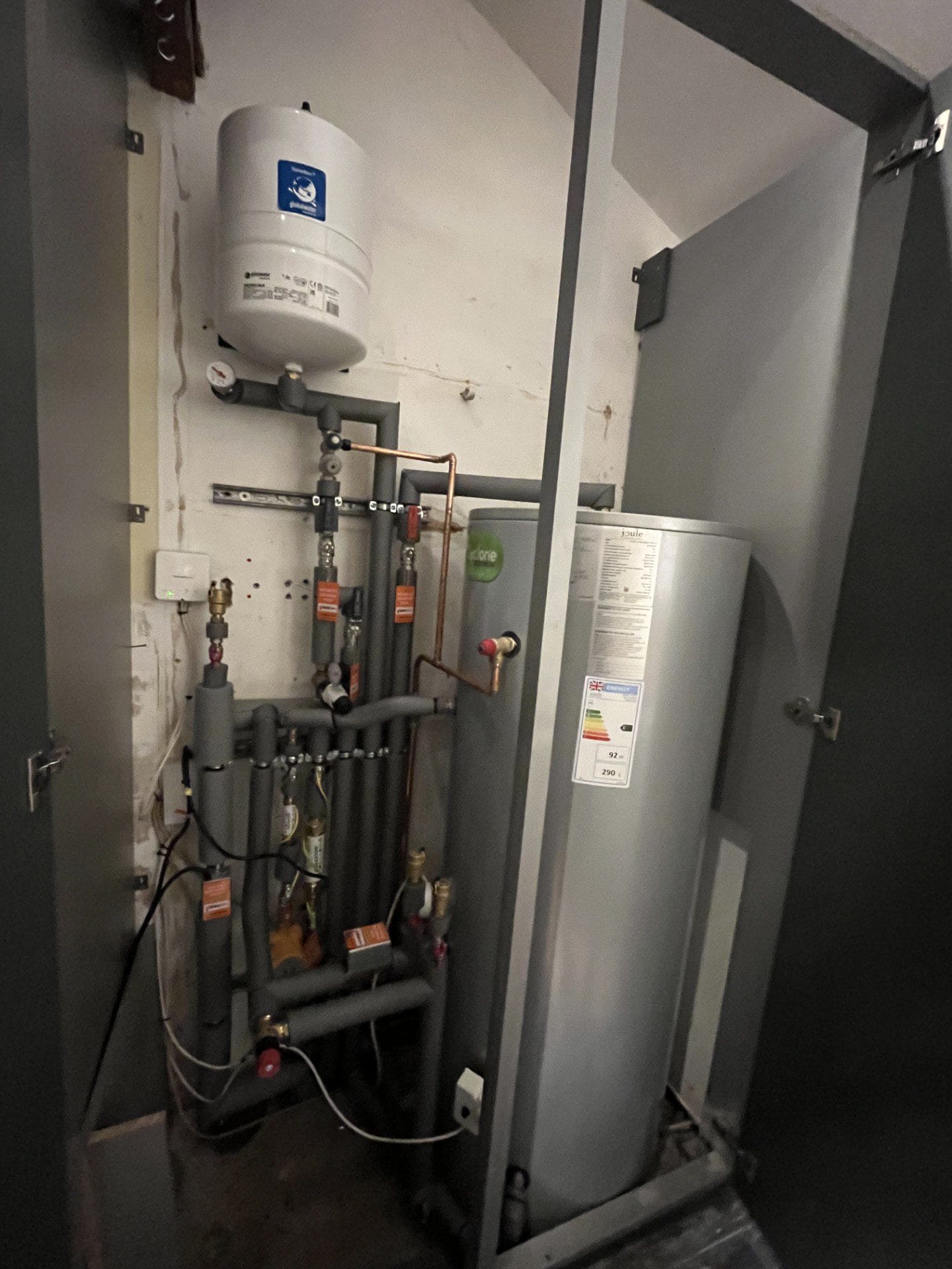 Hot water cylinder installation in Norwich with expansion vessel, controls and insulated pipework