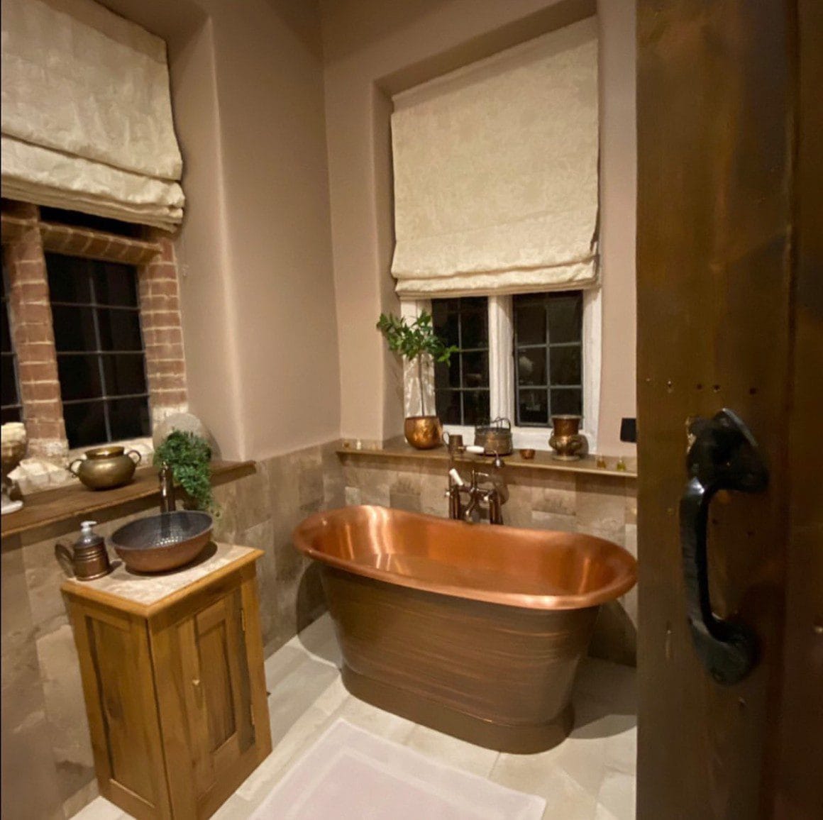 Traditional luxury bathroom installation in Norfolk with copper freestanding bath and vanity basin