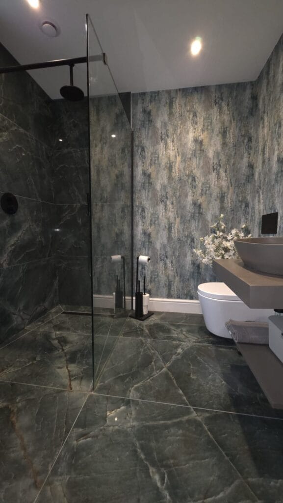 Luxury bathroom installation in Norwich with walk-in shower, glass screen, WC and modern basin