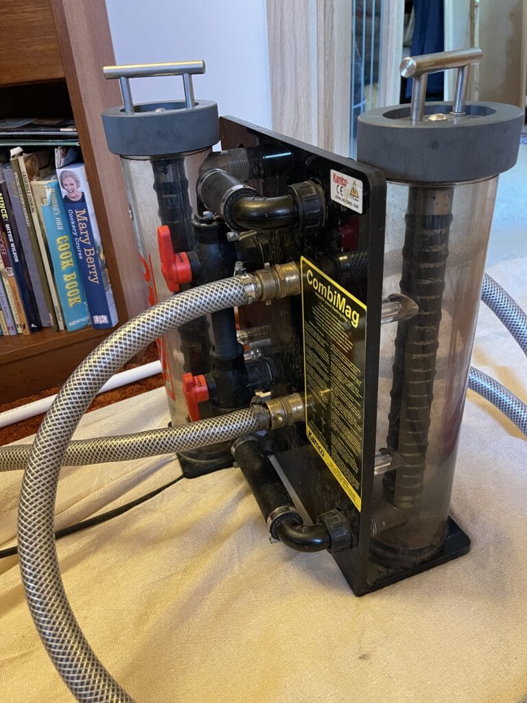 Power flushing equipment connected to a central heating system in Norwich