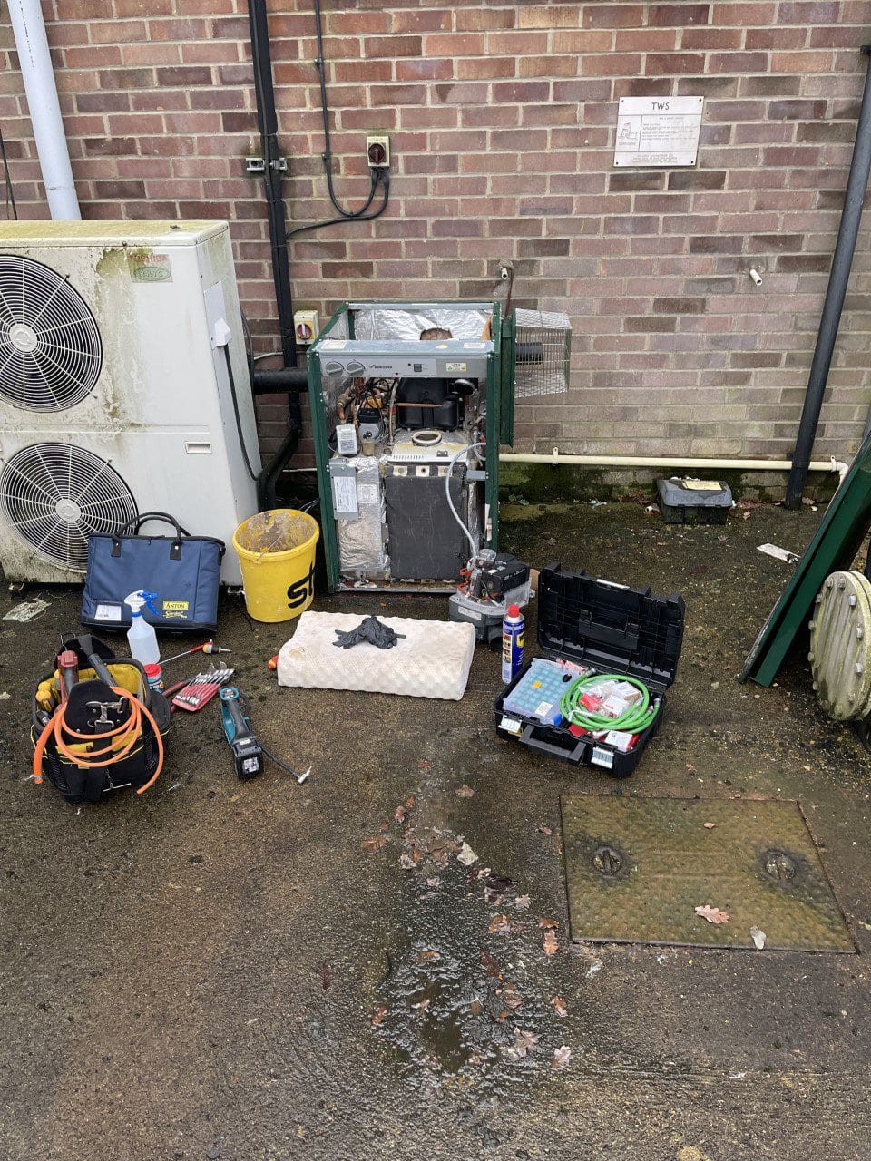 Boiler service in Norfolk with external boiler opened for inspection and maintenance