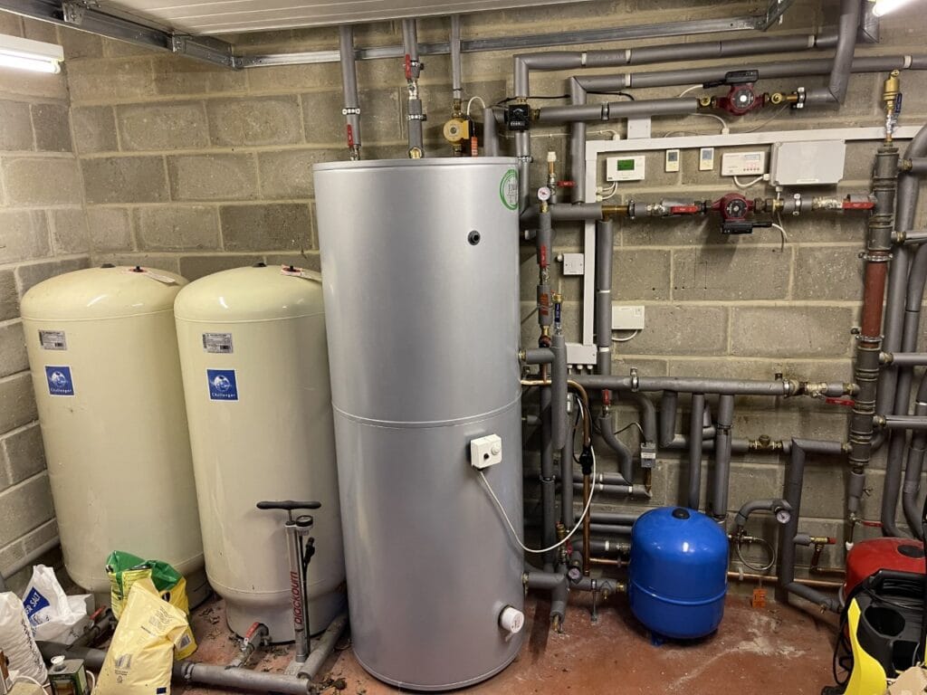 Unvented hot water cylinder installation in Norwich with expansion vessels and heating pipework