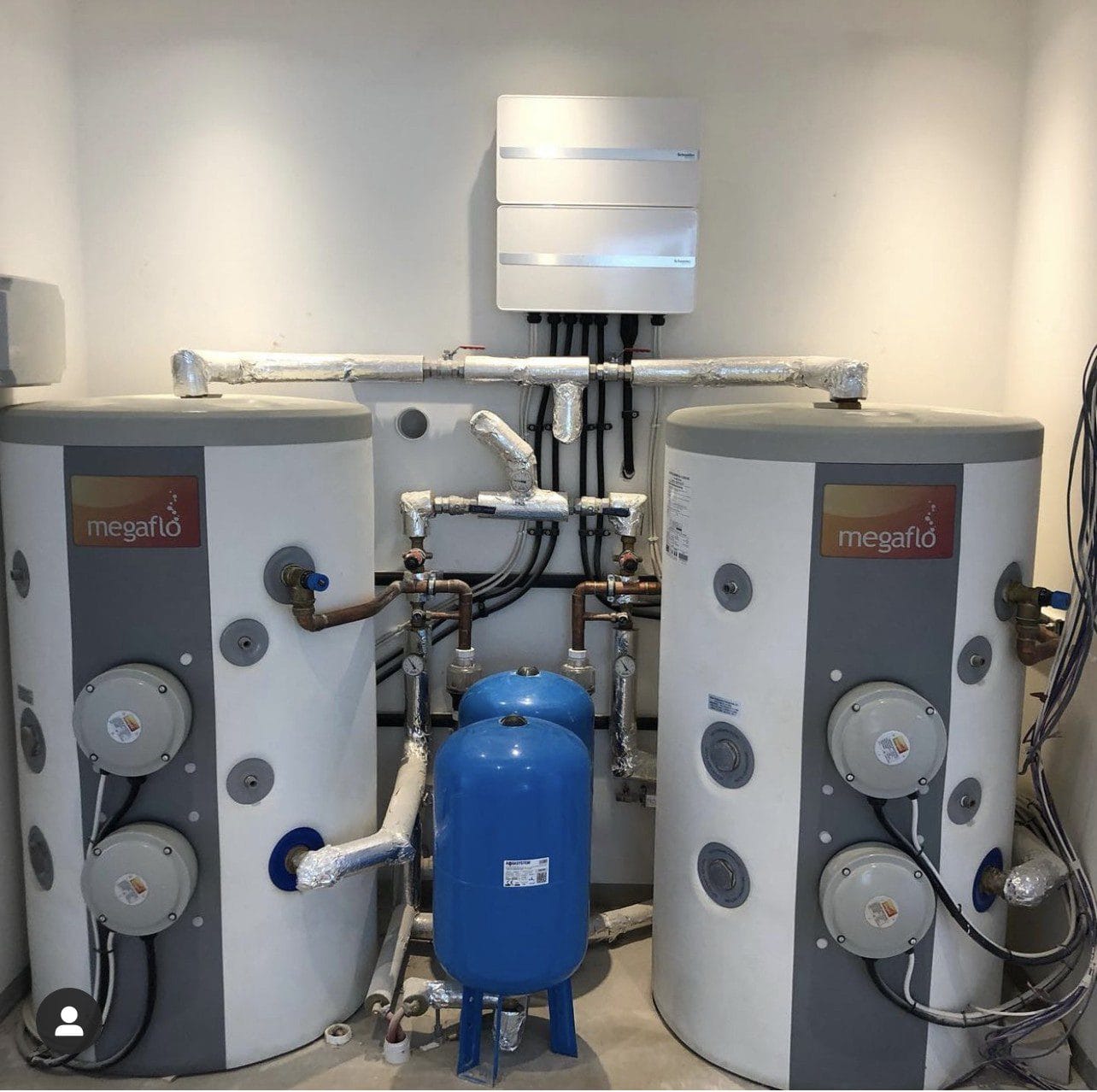 Commercial unvented hot water system installation in Norfolk with twin Megaflo cylinders and expansion vessels