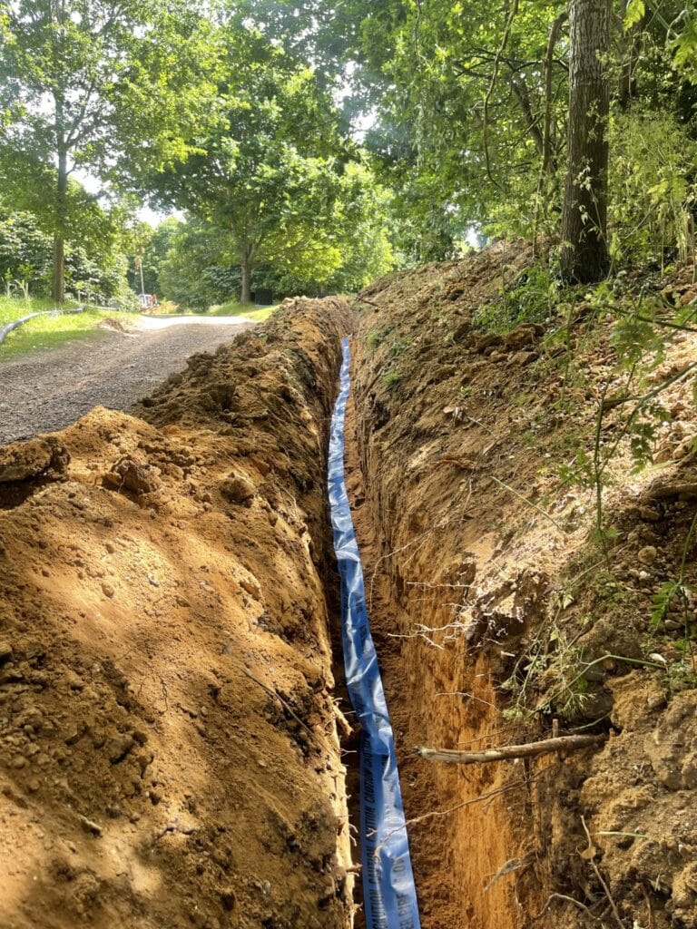 Plumber checking low water pressure in a Horning property