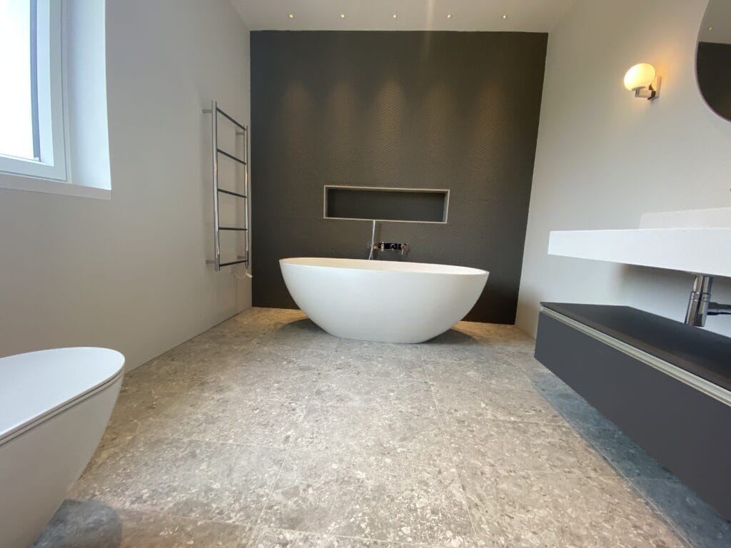 Bathroom Layout, Shower Pressure and Hot Water Planning for Hunstanton Bungalows and Ground-Floor Extensions | Allstar Systems Ltd Plumber assessing shower pressure and bathroom layout in a Hunstanton bungalow