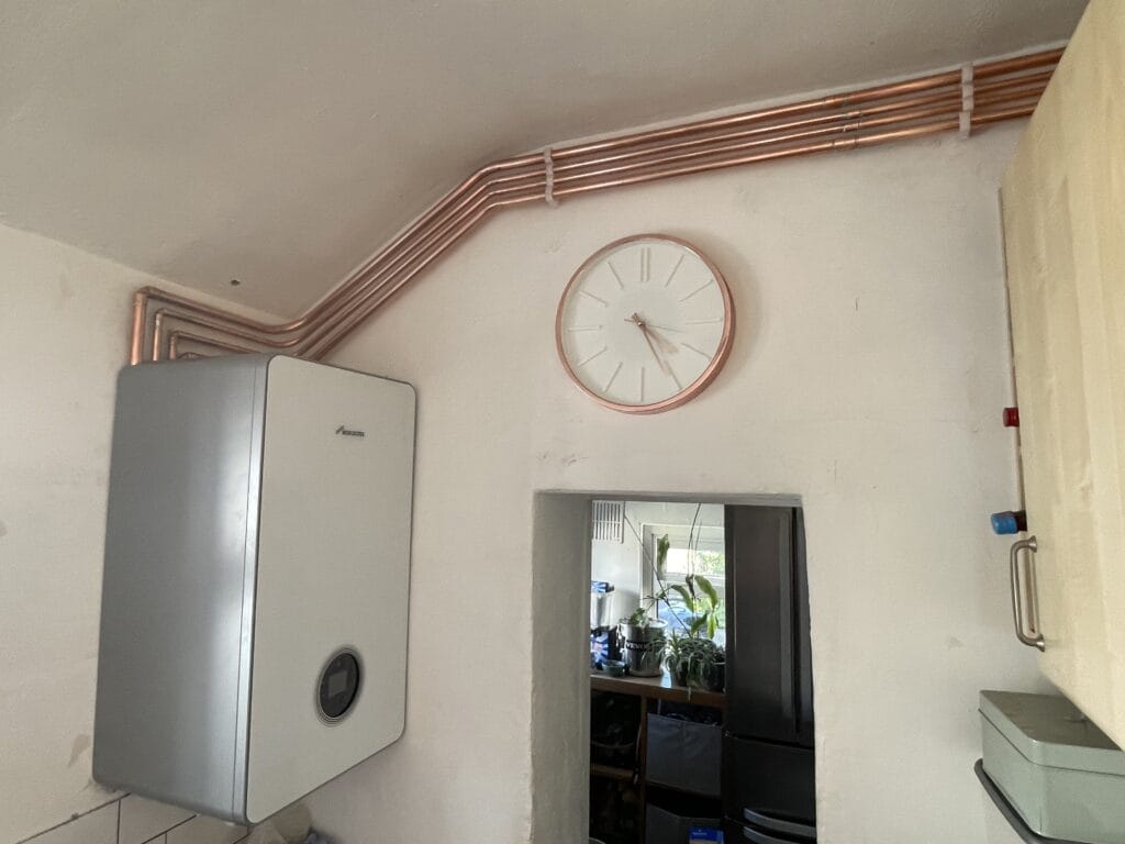 Combi boiler installation in Norwich with neat copper pipework and wall-mounted Worcester Bosch boiler