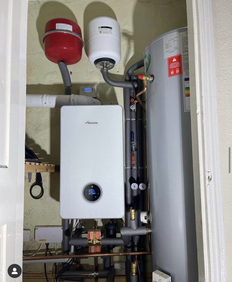 Heating engineer comparing gas oil and LPG boiler options for a Horning property