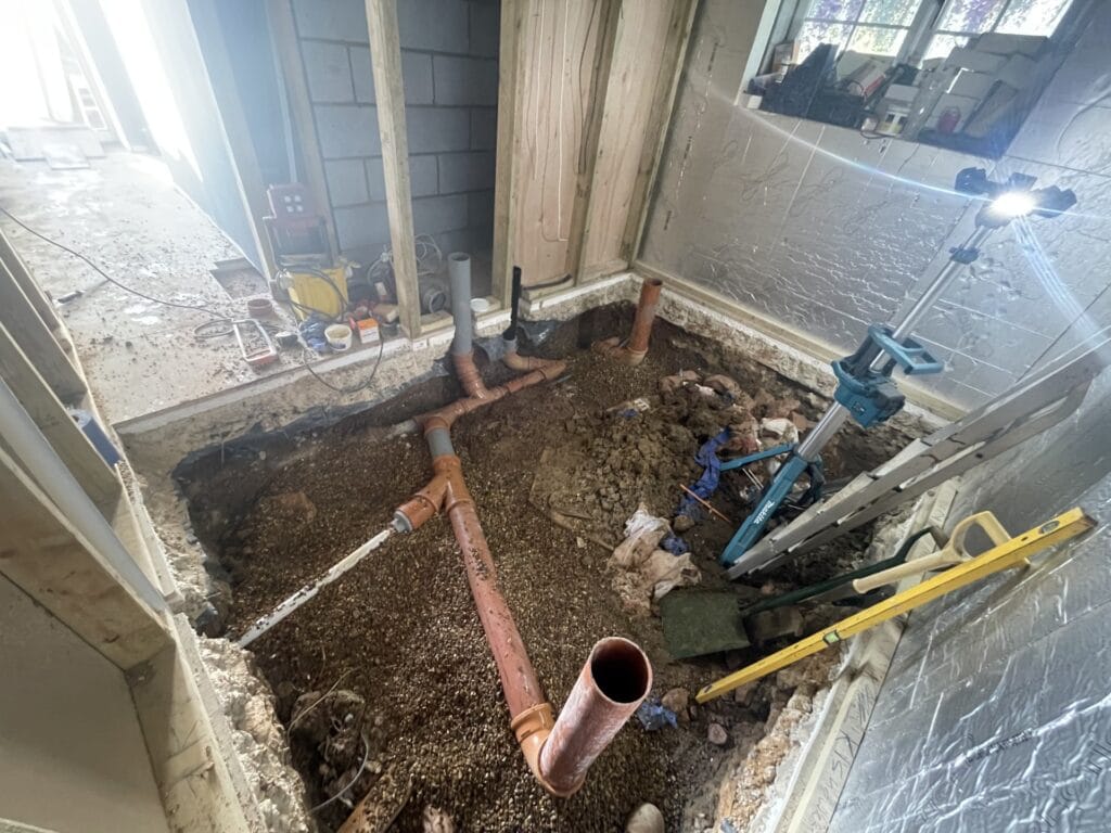 Plumbing in Coltishall Homes: Practical Ways to Prevent Leaks and Water Problems | Allstar Systems Ltd Plumber checking pipework to prevent leaks in a Coltishall home