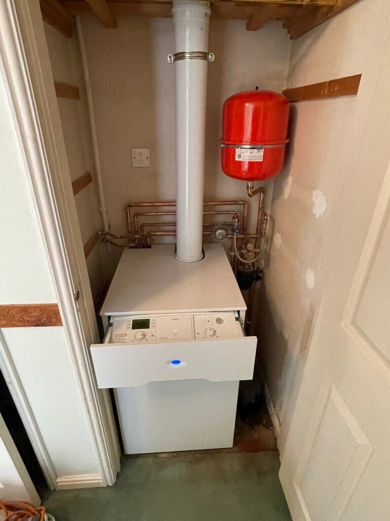 Heating engineer checking gas oil and LPG boiler options for an Aylsham home