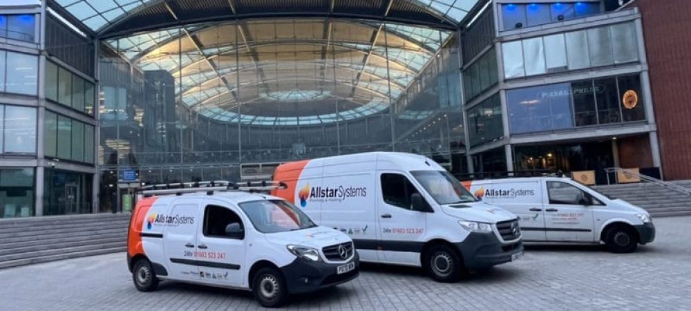 Commercial plumbing and heating engineer working at an Aylsham business premises