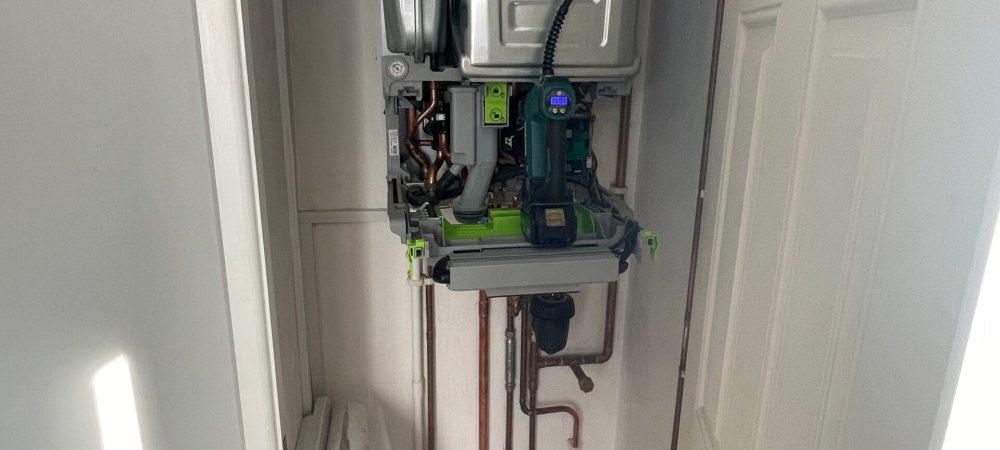 Heating engineer checking recurring boiler pressure loss in a North Walsham home