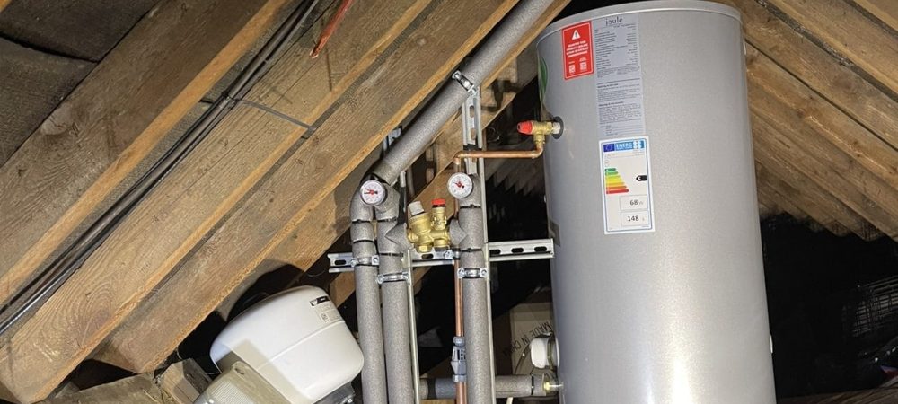 Plumber checking shower pressure and hot water recovery in a Wells-next-the-Sea home