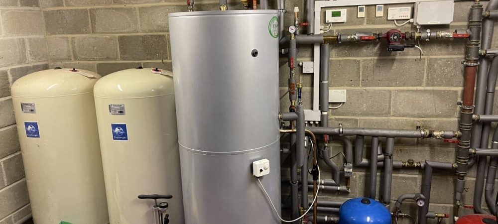 Plumbing and heating engineer checking systems in a Wroxham holiday let