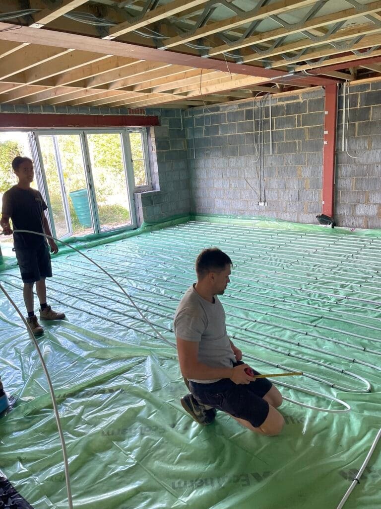 Underfloor Heating and Smart Controls for North Walsham Renovations and Extensions | Allstar Systems Ltd Heating engineer planning underfloor heating and smart controls in a North Walsham renovation