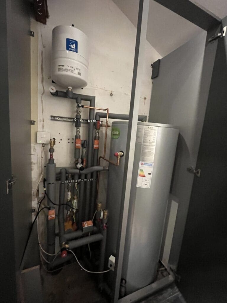 Heating Controls and Radiator Balancing for Older Holt Homes | Allstar Systems Ltd Heating engineer balancing radiators and checking controls in an older Holt home